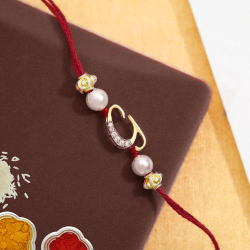 Malabar Gold Alphabet G Two-in-One Rakhi and Pendant