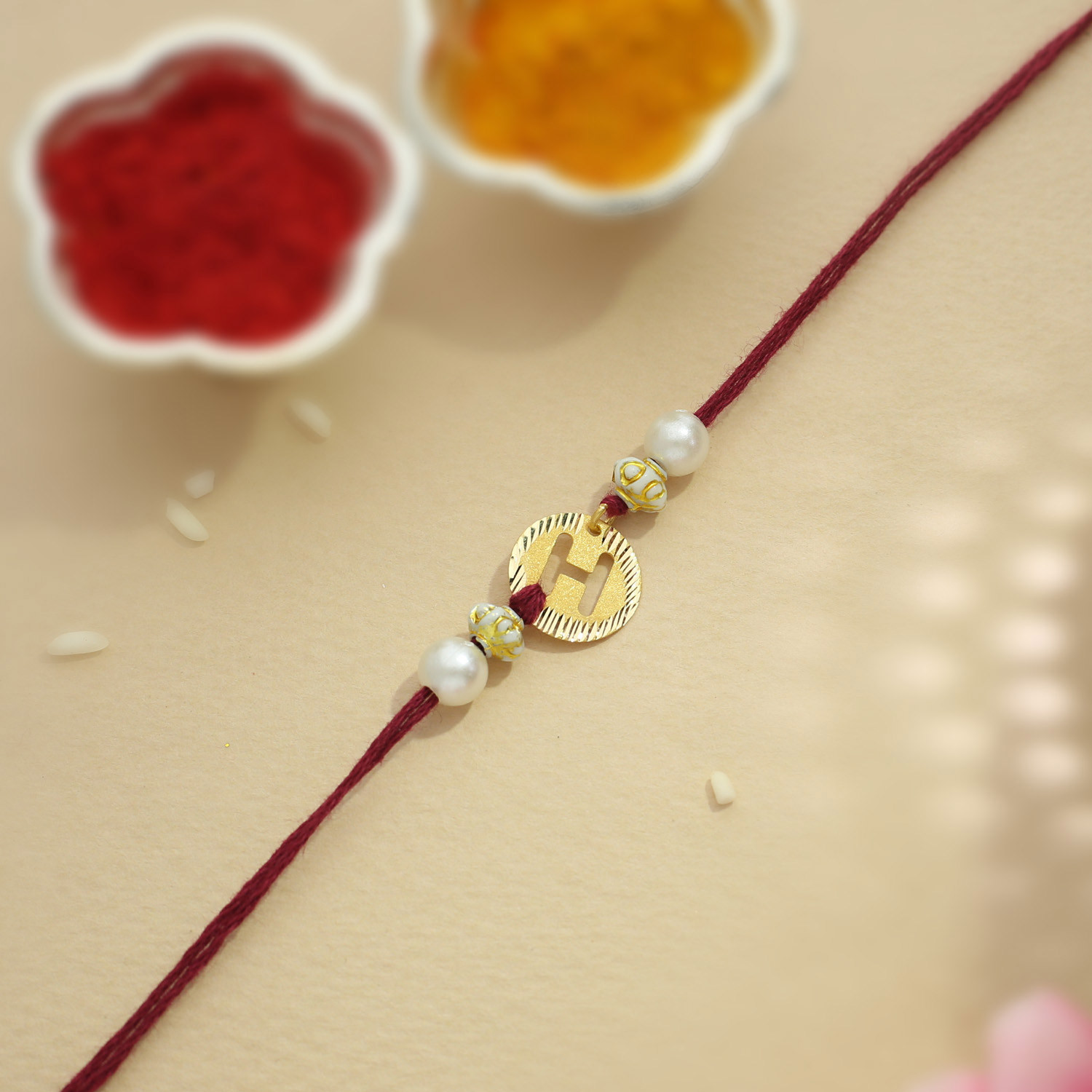 Buy Malabar Gold Circle Motif H Alphabet Two in One Rakhi and