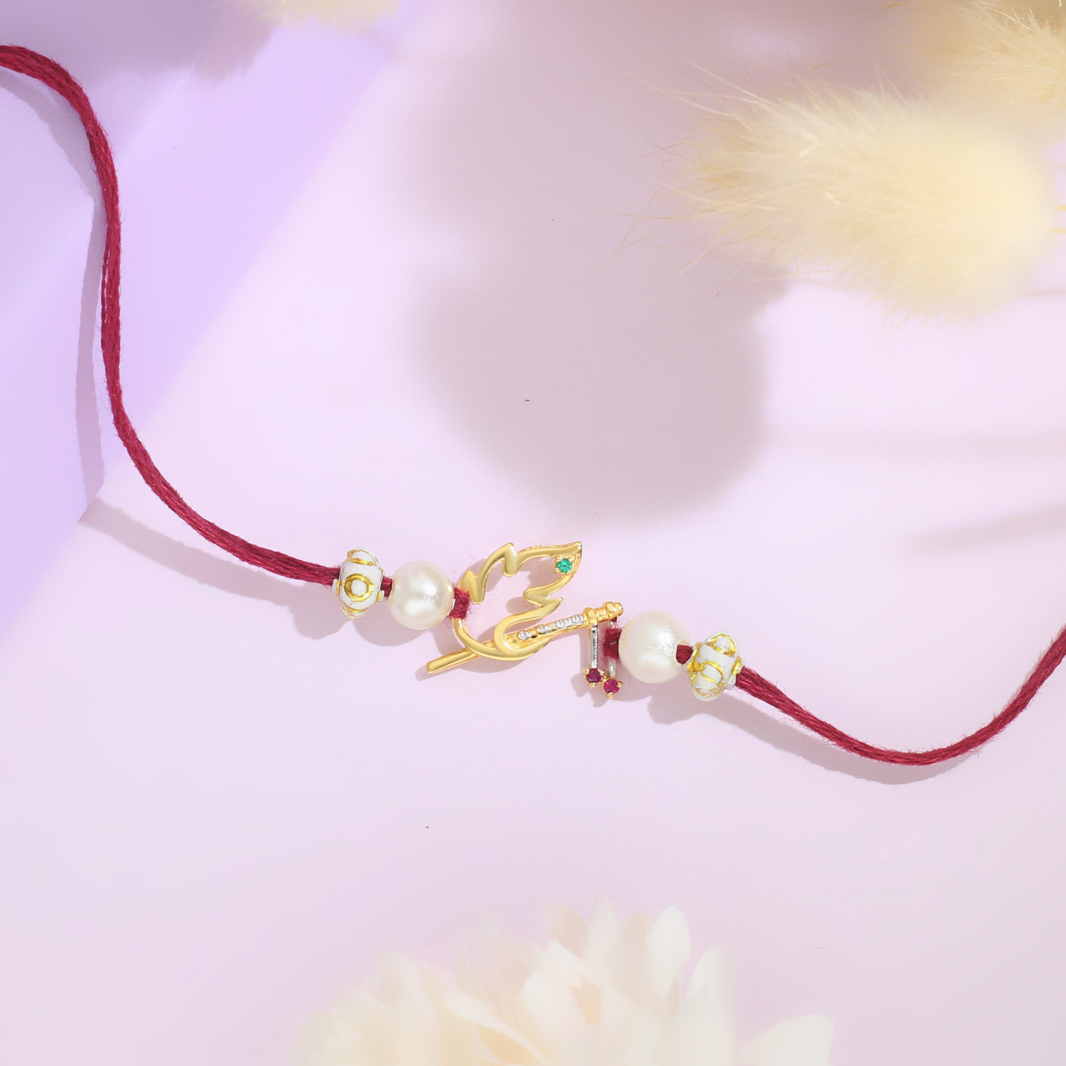 Malabar Gold Krishna Basuri Two-in-One Rakhi and Pendant