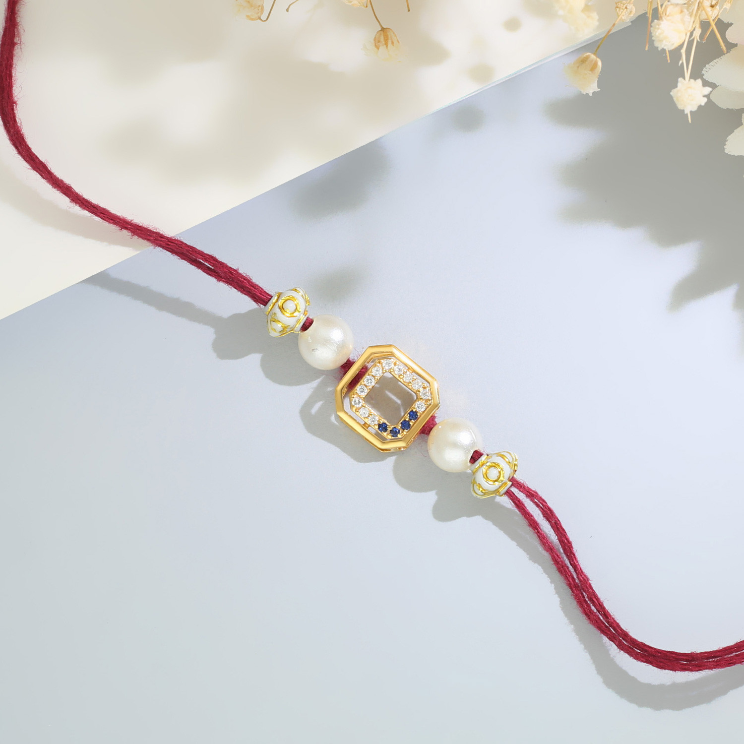 Malabar Gold Geometric Octagon Two-in-One Rakhi and Pendant