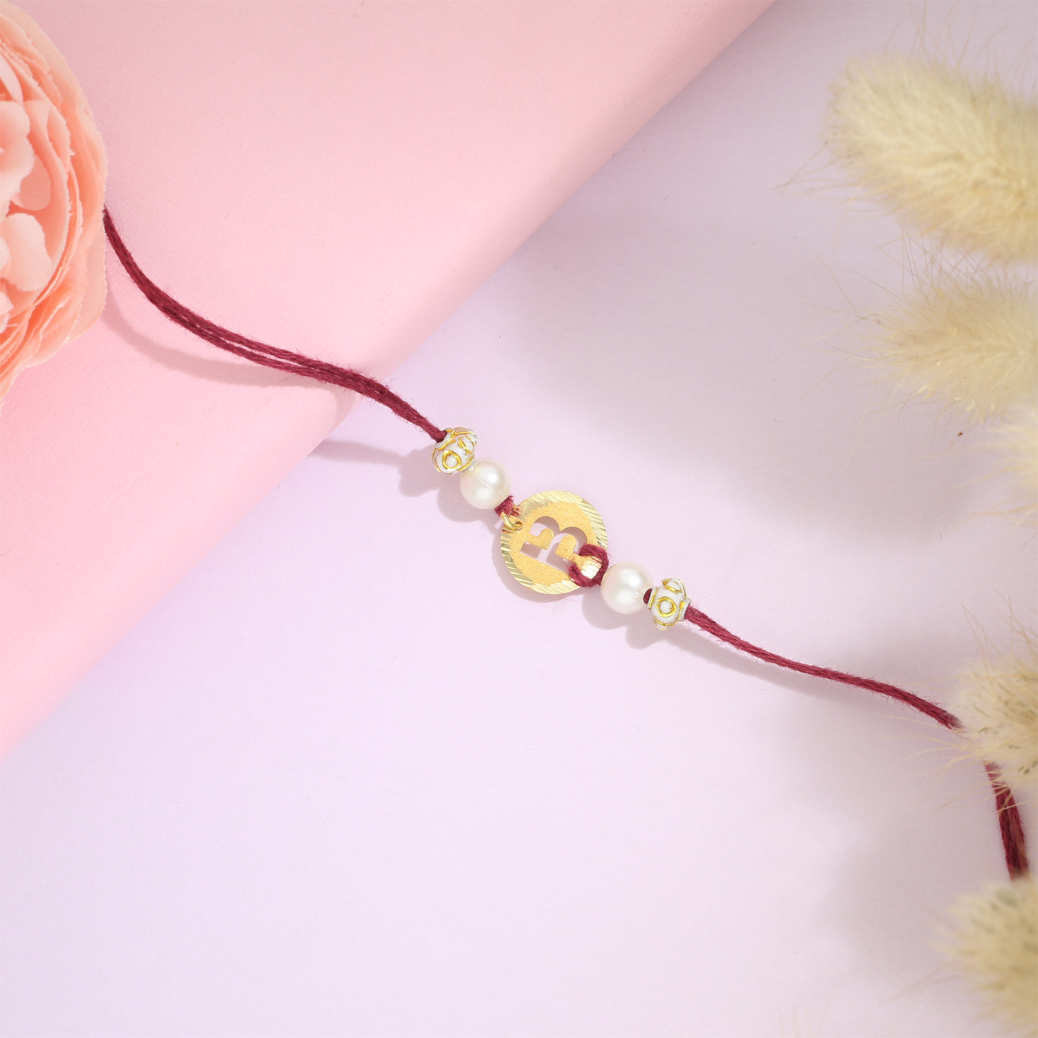 Malabar Gold Circle Motif B Alphabet Two-in-One Rakhi and Pendant