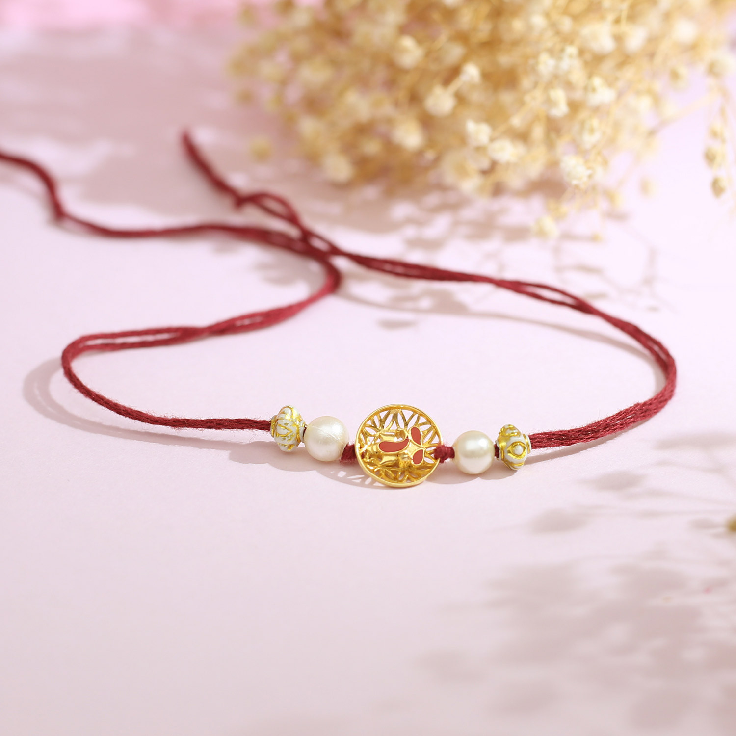 Malabar 14Kt Yellow Gold Ganapati Two-in-One Rakhi and Pendant