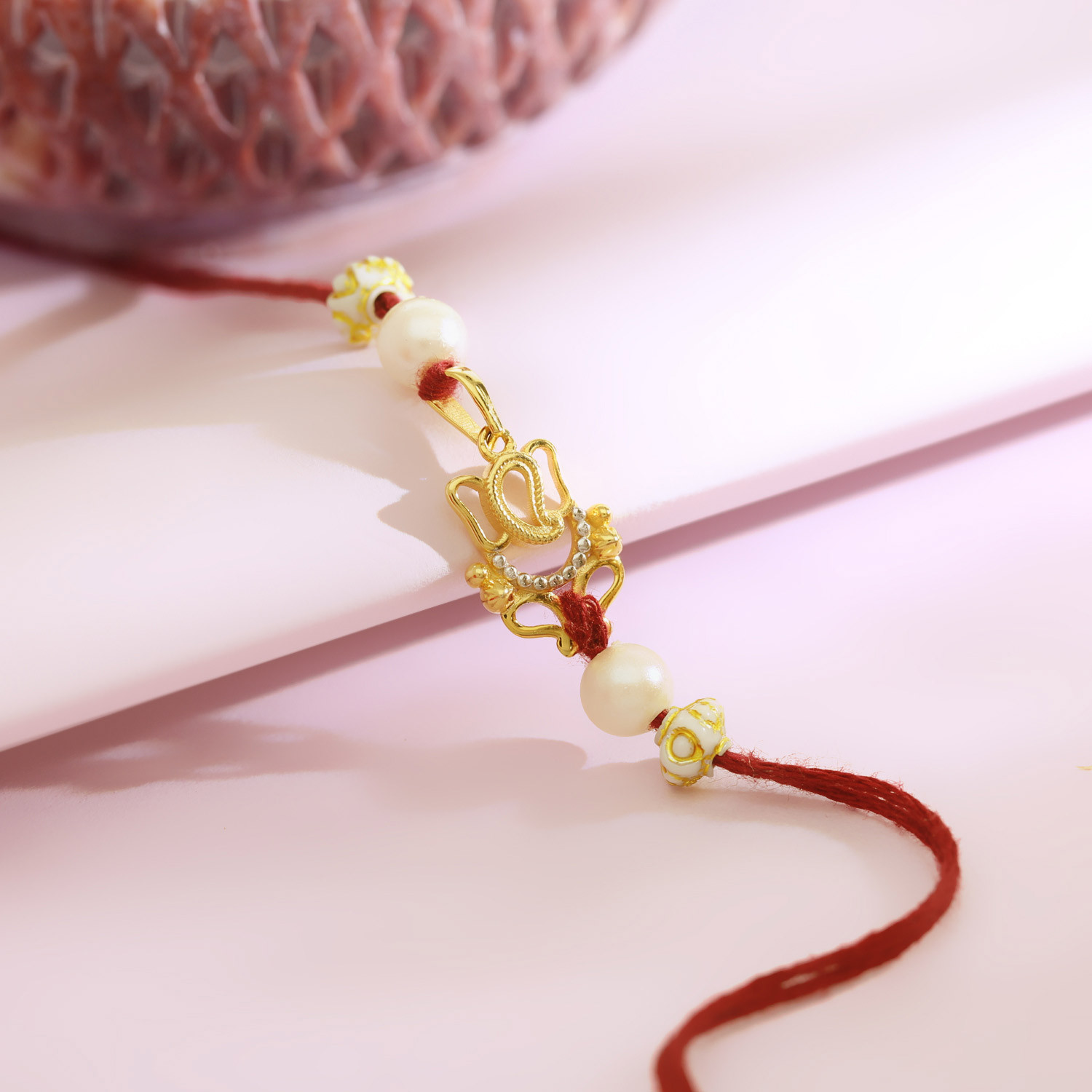 Malabar 14Kt Yellow Gold Vakratund Two-in-One Rakhi and Pendant