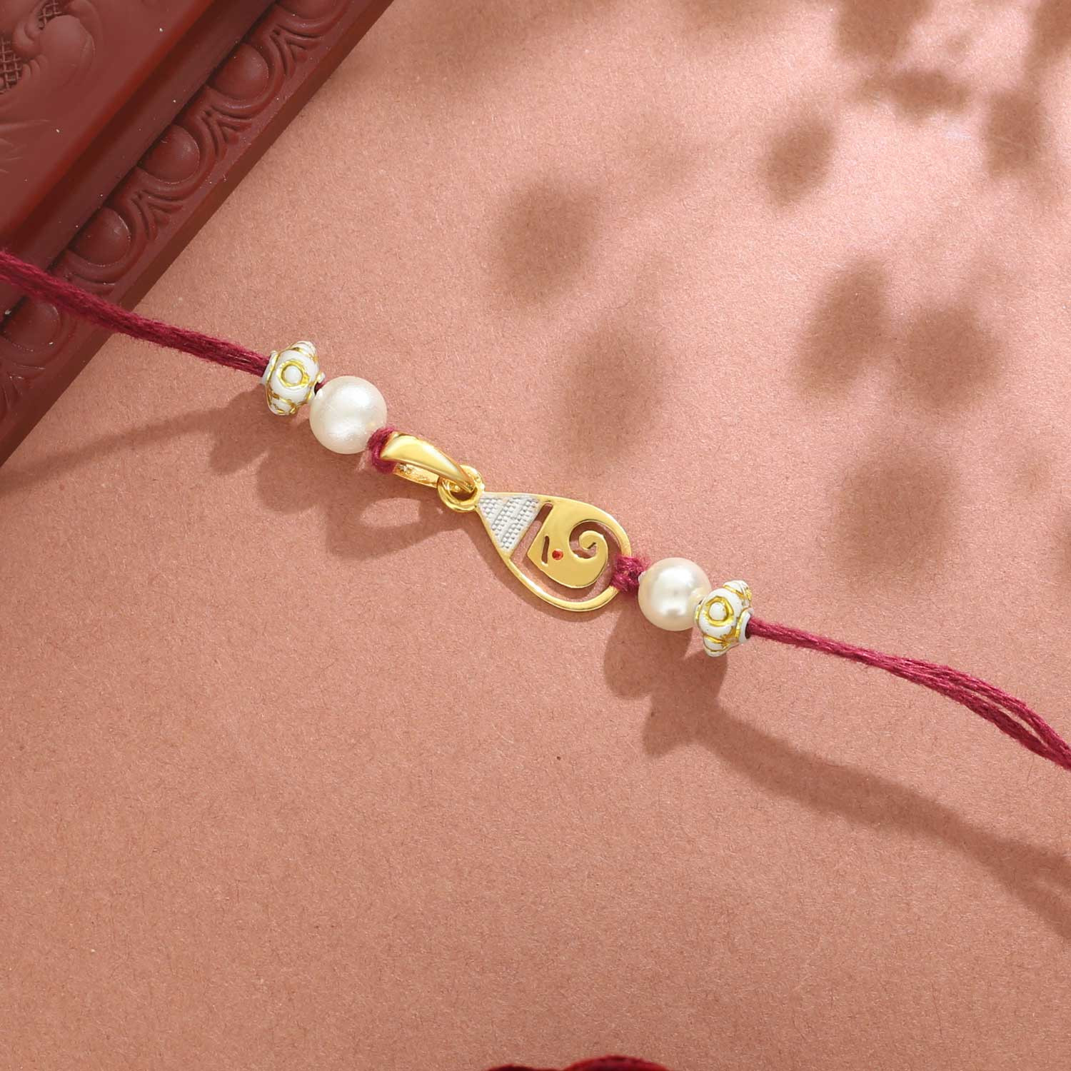 Malabar Gold Rodium Ganesha Two-in-One Rakhi and Pendant