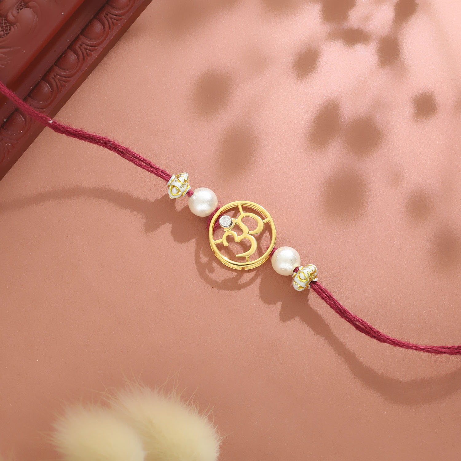 Malabar Gold Studded OM Two-in-One Rakhi and Pendant