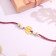 Malabar Gold Circle Motif J Alphabet Two-in-One Rakhi and Pendant