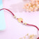 Malabar Gold Circle Motif K Alphabet Two-in-One Rakhi and Pendant